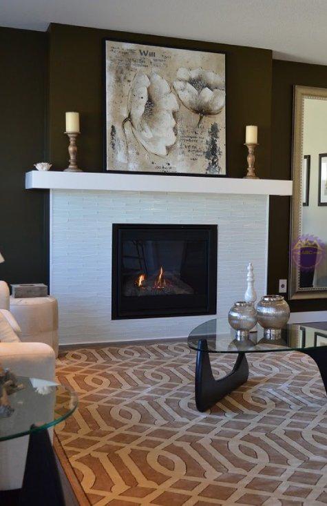 Dark brown walls, white fireplace, and eggshell-colored walls.